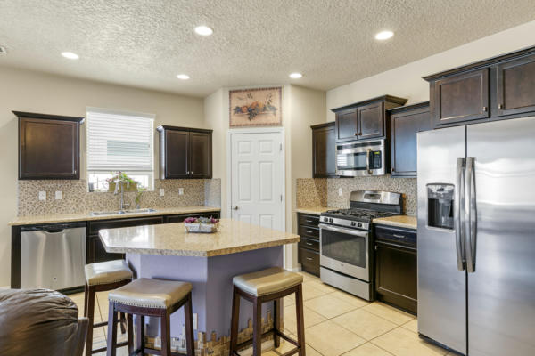 7023 TOMBSTONE RD NW, ALBUQUERQUE, NM 87114, photo 5 of 25